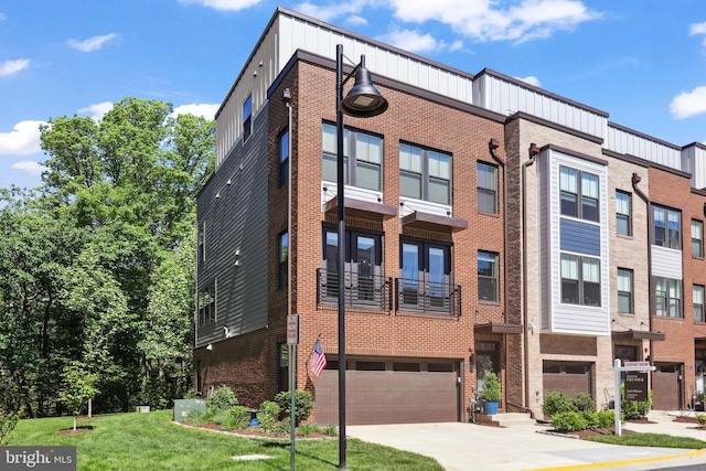 1653 Bandit Loop, Reston, VA 20190 - multi unit property featuring a garage, driveway, brick siding, board and batten siding, and a front yard