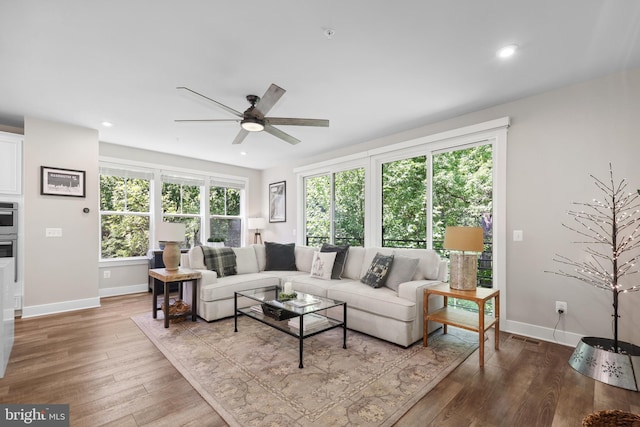 1653 Bandit Loop, Reston, VA 20190 - living area featuring a ceiling fan, baseboards, wood finished floors, and recessed lighting
