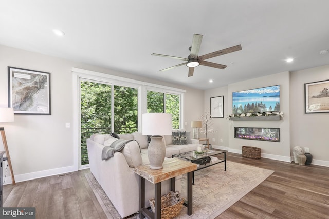 1653 Bandit Loop, Reston, VA 20190 - living room featuring ceiling fan, wood finished floors, baseboards, and recessed lighting