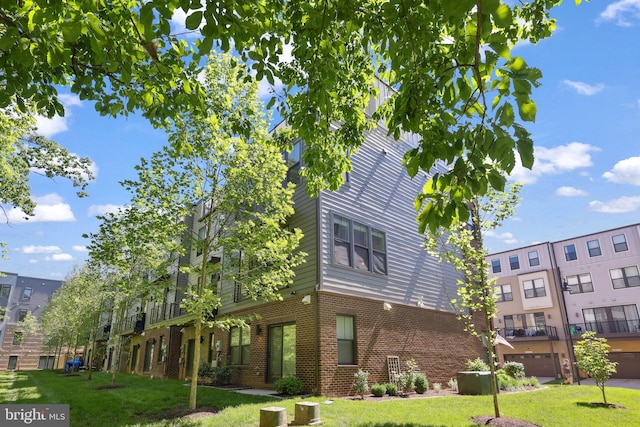 1653 Bandit Loop, Reston, VA 20190 - view of home's exterior with a lawn and brick siding