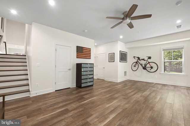 1653 Bandit Loop, Reston, VA 20190 - unfurnished living room featuring a ceiling fan, wood finished floors, stairs, baseboards, and recessed lighting