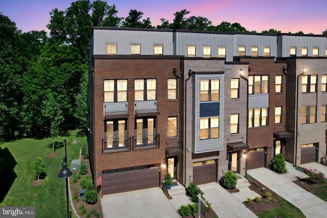 1653 Bandit Loop, Reston, VA 20190 - multi unit property with a garage, brick siding, driveway, and a lawn