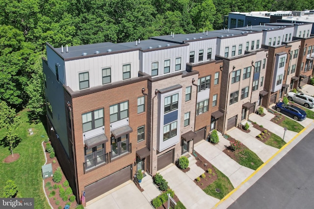 1653 Bandit Loop, Reston, VA 20190 - view of building exterior featuring an attached garage and driveway