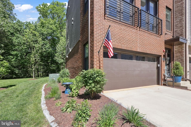 1653 Bandit Loop, Reston, VA 20190 - view of side of property featuring driveway, brick siding, an attached garage, and a lawn