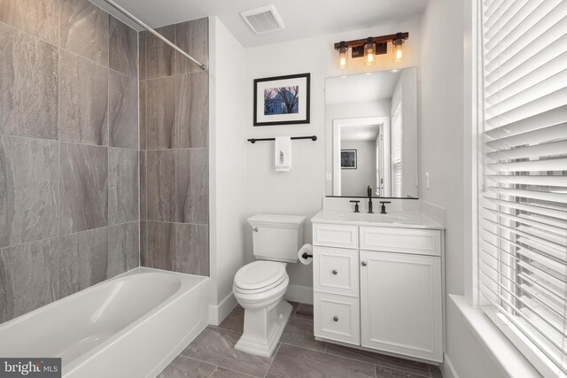 1653 Bandit Loop, Reston, VA 20190 - full bath featuring toilet, vanity, shower / bath combination, and baseboards