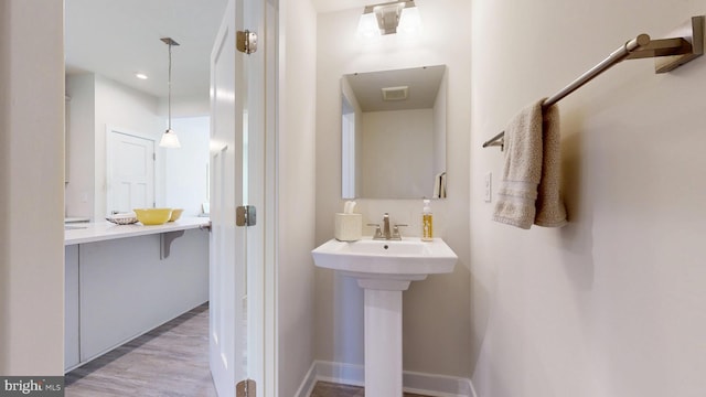 21042 Wavecrest Ter Unit 23, Lewes, DE 19958 - bathroom with wood finished floors and a sink