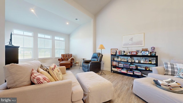 21042 Wavecrest Ter Unit 23, Lewes, DE 19958 - living room with recessed lighting, baseboards, high vaulted ceiling, and wood finished floors