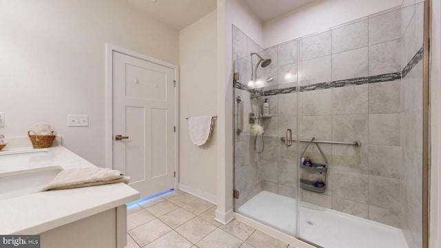 21042 Wavecrest Ter Unit 23, Lewes, DE 19958 - full bath with tile patterned floors, vanity, baseboards, and a stall shower