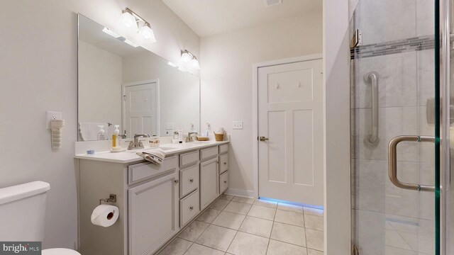 21042 Wavecrest Ter Unit 23, Lewes, DE 19958 - full bath with tile patterned floors, double vanity, a shower stall, and a sink