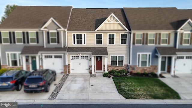 21042 Wavecrest Ter Unit 23, Lewes, DE 19958 - townhome / multi-family property featuring driveway, a front yard, a garage, a shingled roof, and stone siding