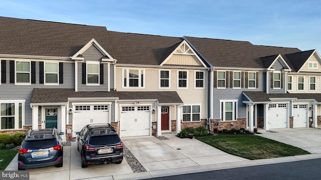 21042 Wavecrest Ter Unit 23, Lewes, DE 19958 - view of property with an attached garage, stone siding, and driveway