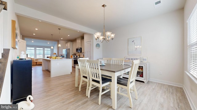 21042 Wavecrest Ter Unit 23, Lewes, DE 19958 - dining room featuring light wood-style flooring, recessed lighting, baseboards, and a chandelier