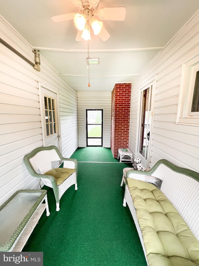 sunroom with a ceiling fan
