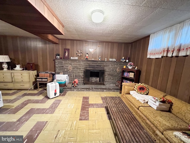 living room featuring tile patterned floors, wooden walls, and a fireplace with raised hearth