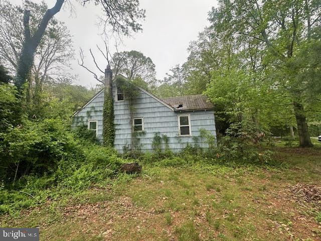 704 E Forest Grove Rd, Vineland, NJ 08360 - view of home's exterior featuring a chimney