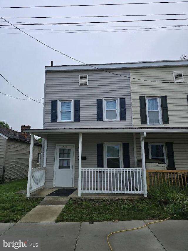 view of property with a porch