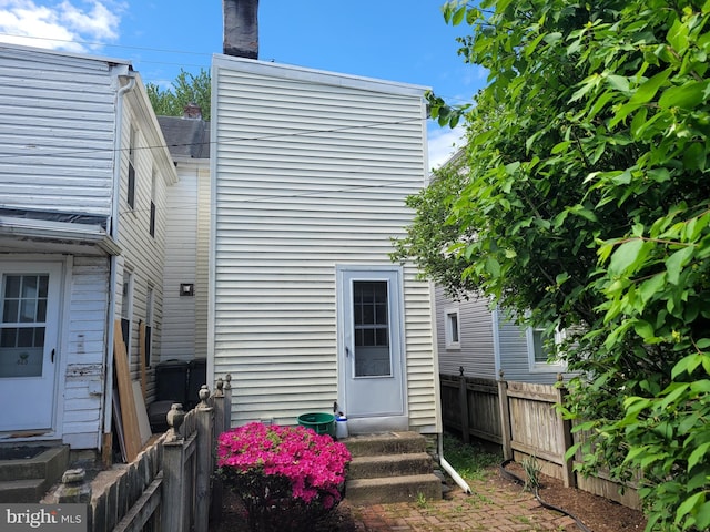 625 5th St, Lancaster, PA 17603 - rear view of property with a chimney, entry steps, and fence