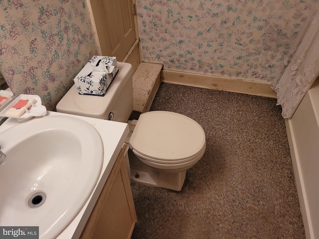 625 5th St, Lancaster, PA 17603 - bathroom featuring wallpapered walls, toilet, and a sink