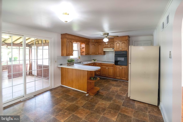kitchen featuring black appliances, a peninsula, open shelves, under cabinet range hood, and ornamental molding