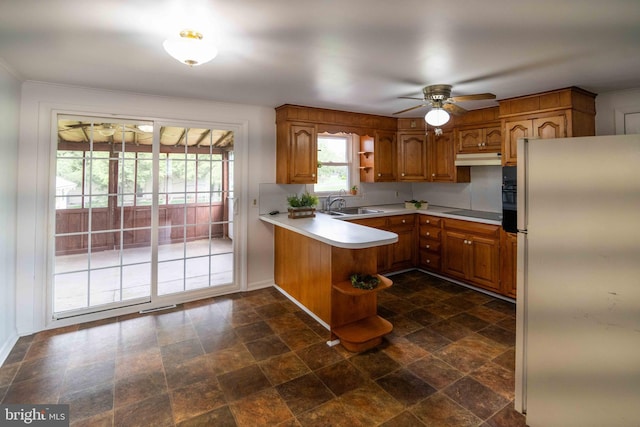 kitchen with black appliances, a peninsula, open shelves, ceiling fan, and ornamental molding