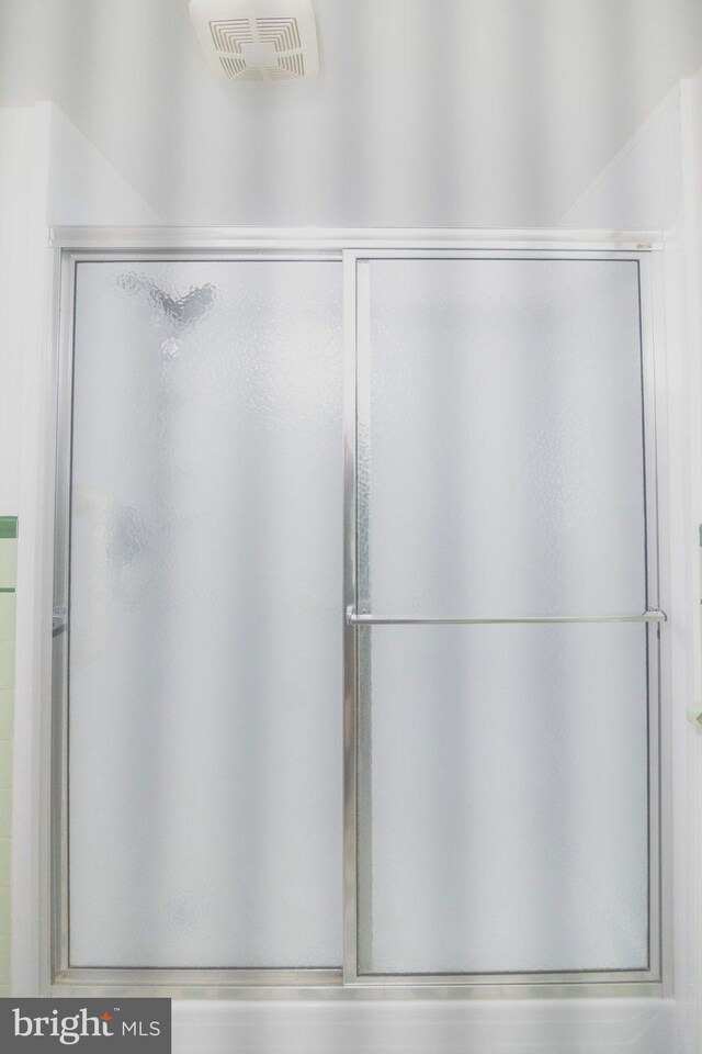 full bath featuring a shower stall