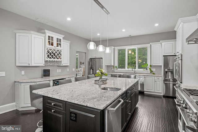 22 Grassy Lake Rd, Shamong, NJ 08088 - kitchen with high quality appliances, dark cabinets, white cabinets, recessed lighting, and an island with sink