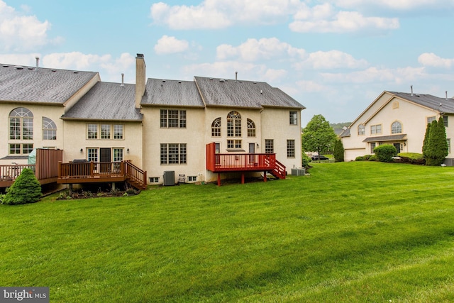 82 Granville Way, Exton, PA 19341 - back of house with stucco siding, a yard, a chimney, and a deck