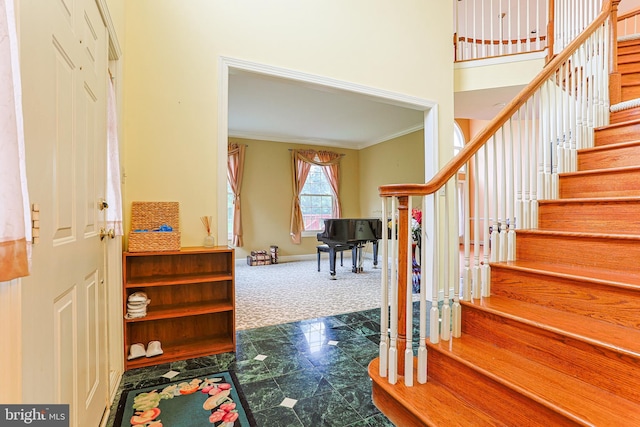 82 Granville Way, Exton, PA 19341 - foyer entrance with stairway, crown molding, carpet floors, and baseboards