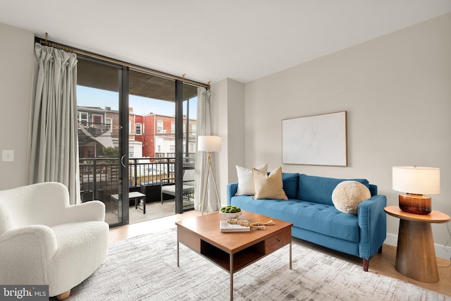 50 Florida Ave NE Unit 312, Washington, DC 20002 - living area with wood finished floors, expansive windows, and baseboards