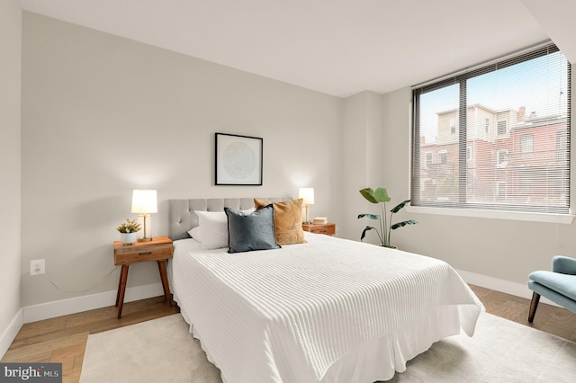 50 Florida Ave NE Unit 312, Washington, DC 20002 - bedroom with baseboards and wood finished floors