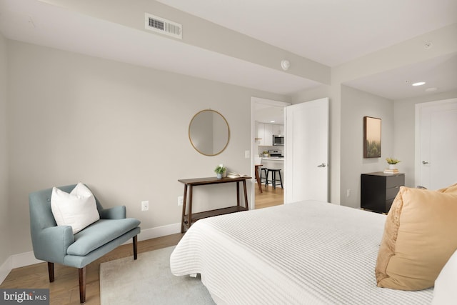 50 Florida Ave NE Unit 312, Washington, DC 20002 - bedroom with light wood finished floors, baseboards, and recessed lighting