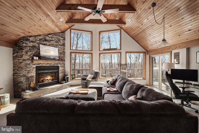 living room with wooden ceiling, a ceiling fan, high vaulted ceiling, a stone fireplace, and carpet flooring