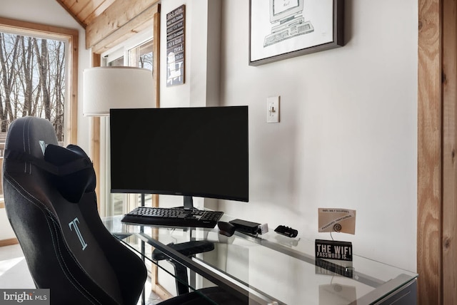office area featuring vaulted ceiling