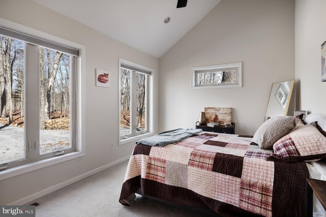 carpeted bedroom featuring high vaulted ceiling, baseboards, and ceiling fan