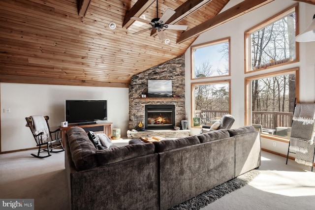 carpeted living area featuring wood ceiling, healthy amount of natural light, ceiling fan, high vaulted ceiling, and baseboards