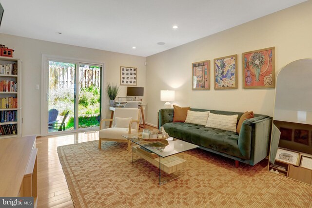 living area with wood finished floors and recessed lighting