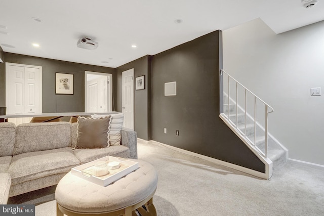 living room featuring baseboards, stairs, carpet flooring, and recessed lighting