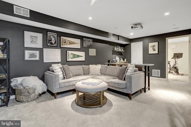 living room with carpet, visible vents, and recessed lighting
