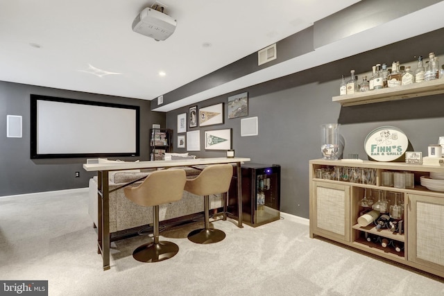 interior space featuring a bar, carpet, and visible vents