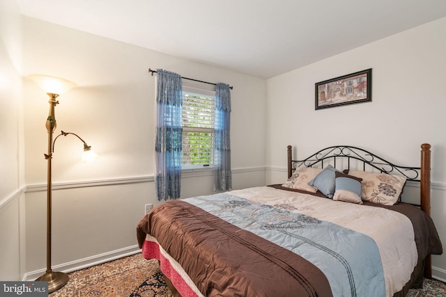 bedroom featuring baseboards