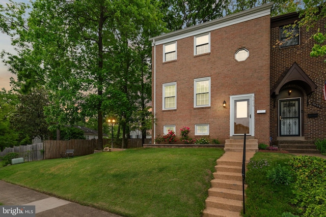 view of front of property featuring brick siding and entry steps