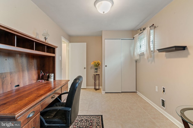 office featuring baseboards and light tile patterned floors