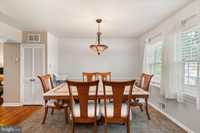 dining room featuring baseboards
