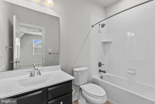 full bathroom with toilet, vanity, and washtub / shower combination