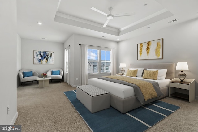 bedroom featuring a raised ceiling, carpet floors, baseboards, ceiling fan, and recessed lighting