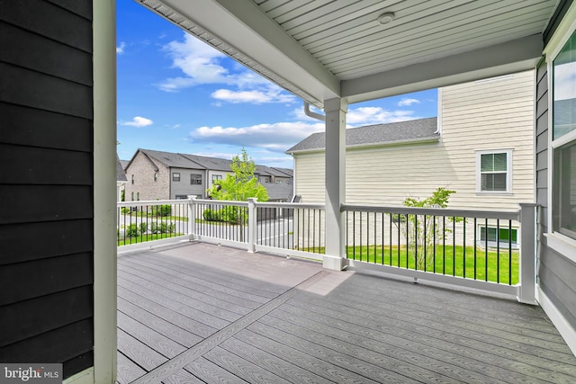 wooden terrace with a residential view