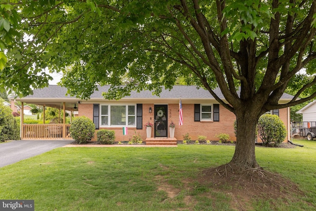 350 Lanny Dr, Winchester, VA 22601 - ranch-style home with brick siding, driveway, a front yard, a carport, and a shingled roof