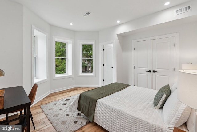 660 Columbia Rd NW, Washington, DC 20001 - bedroom with wood finished floors, a closet, recessed lighting, and baseboards