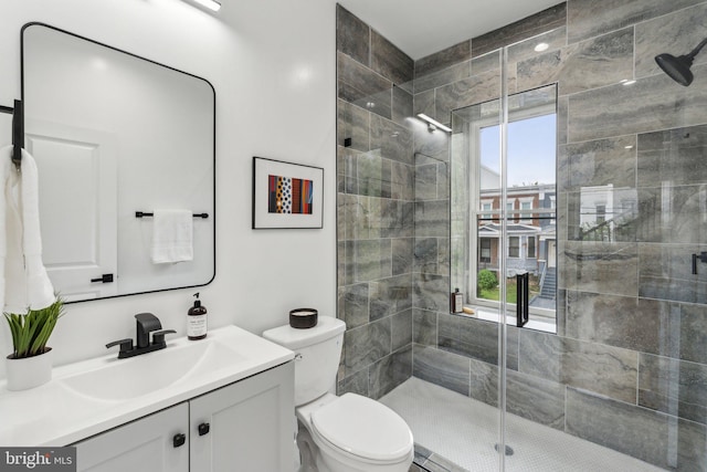 660 Columbia Rd NW, Washington, DC 20001 - bathroom with healthy amount of natural light, a shower stall, vanity, and toilet