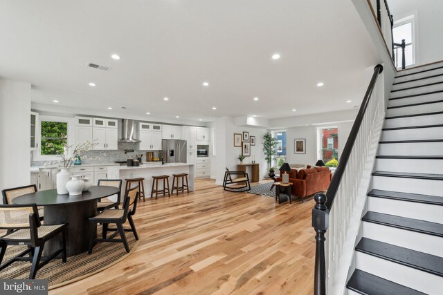 660 Columbia Rd NW, Washington, DC 20001 - dining area with recessed lighting, stairs, and light wood-type flooring